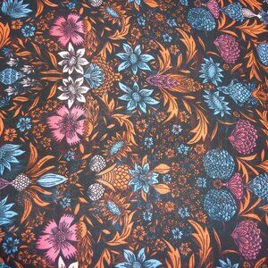 Fabric with blue, orange, red, and pink floral pattern on a black background
